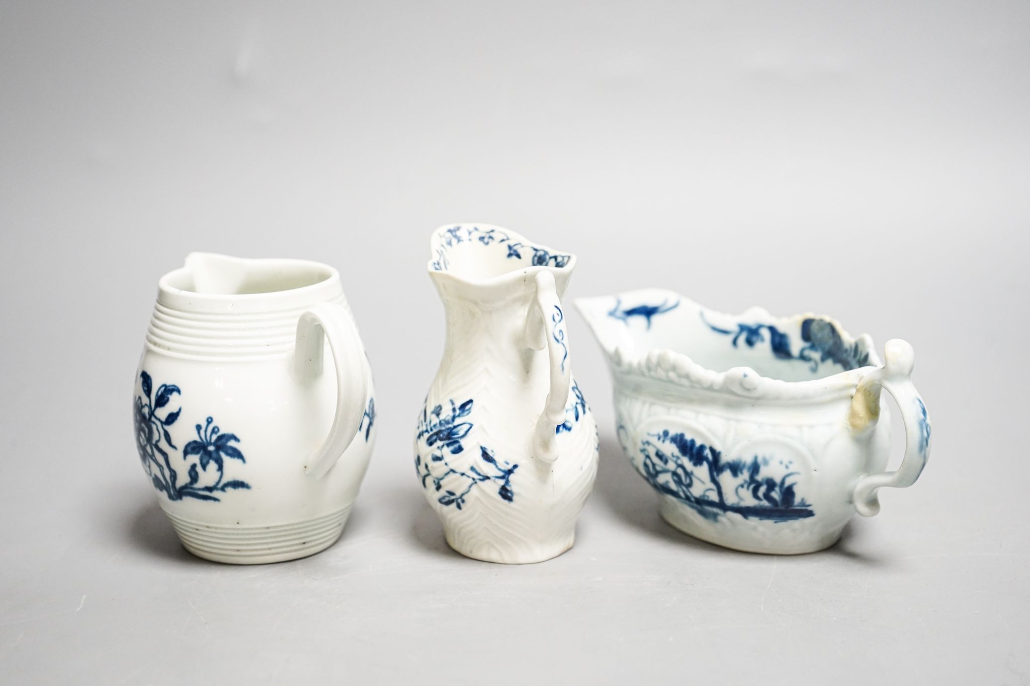 A Worcester blue and white sauceboat, sparrow beak milk jug and a Mansfield pattern milk jug, tallest 9 cm